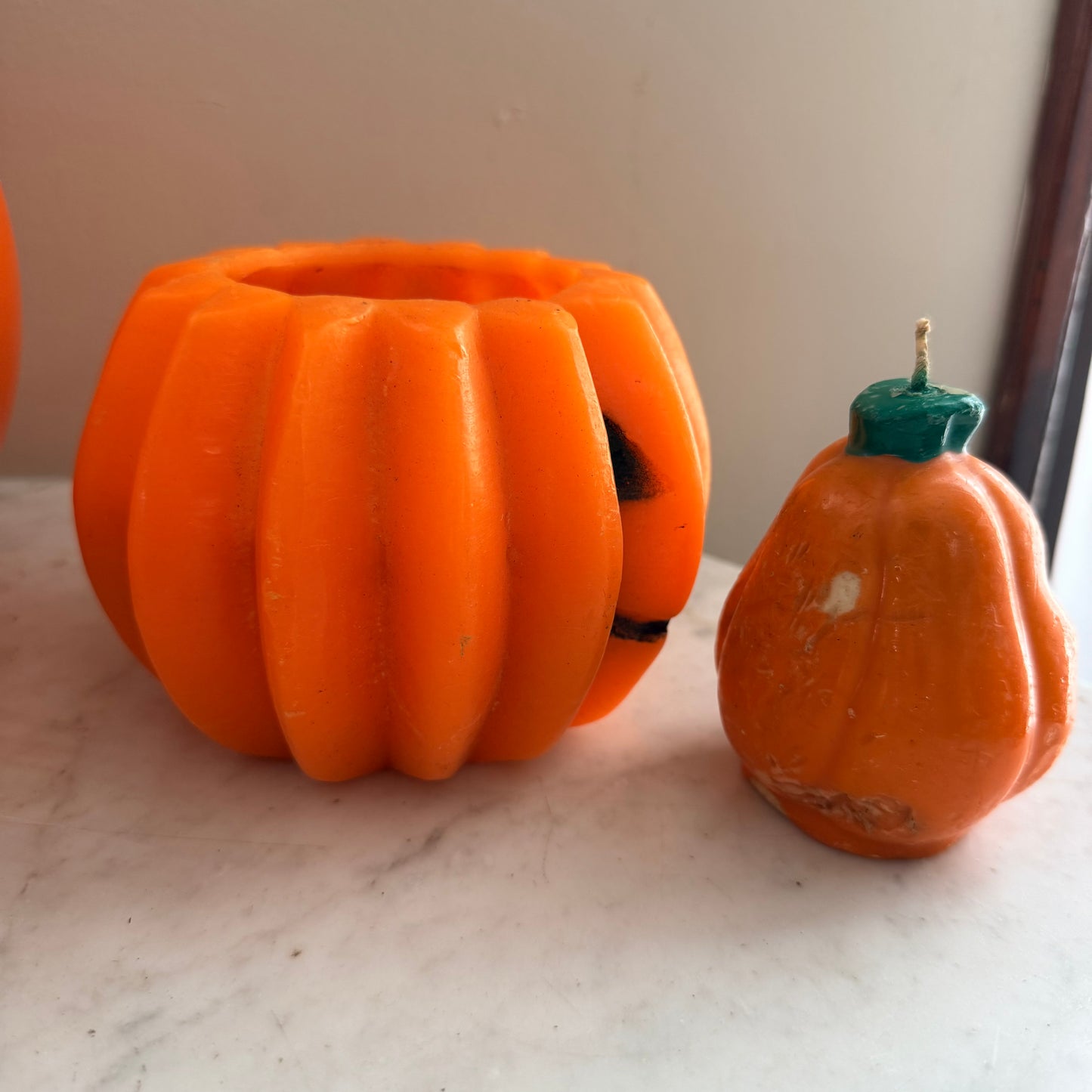 pair of vintage pumpkin candles