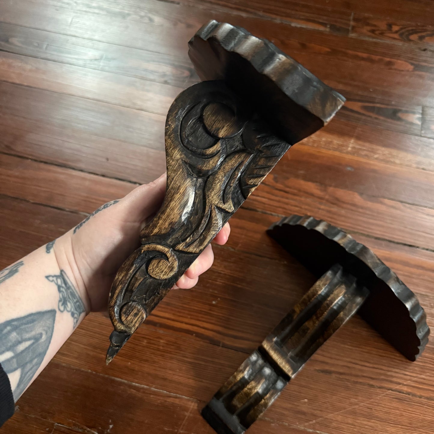 pair of carved wood wall shelves