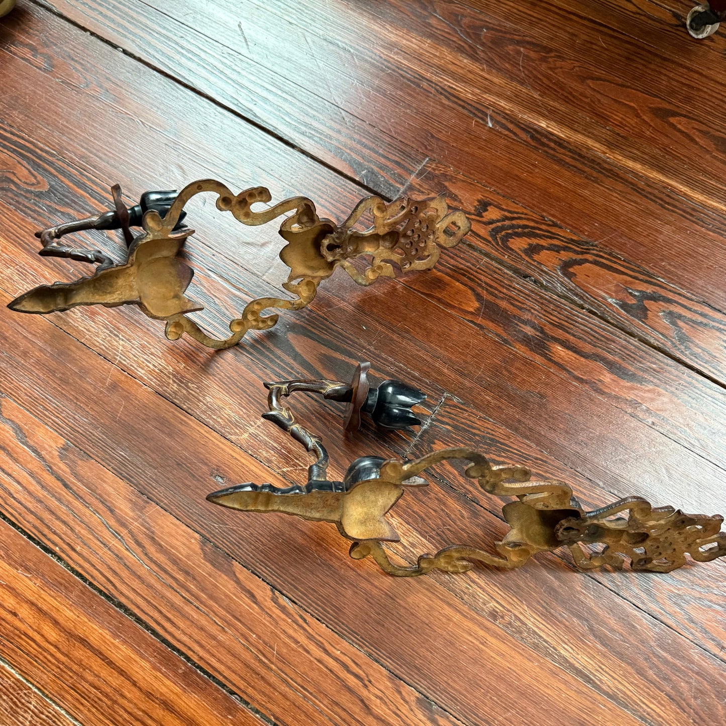pair of cast iron sconces