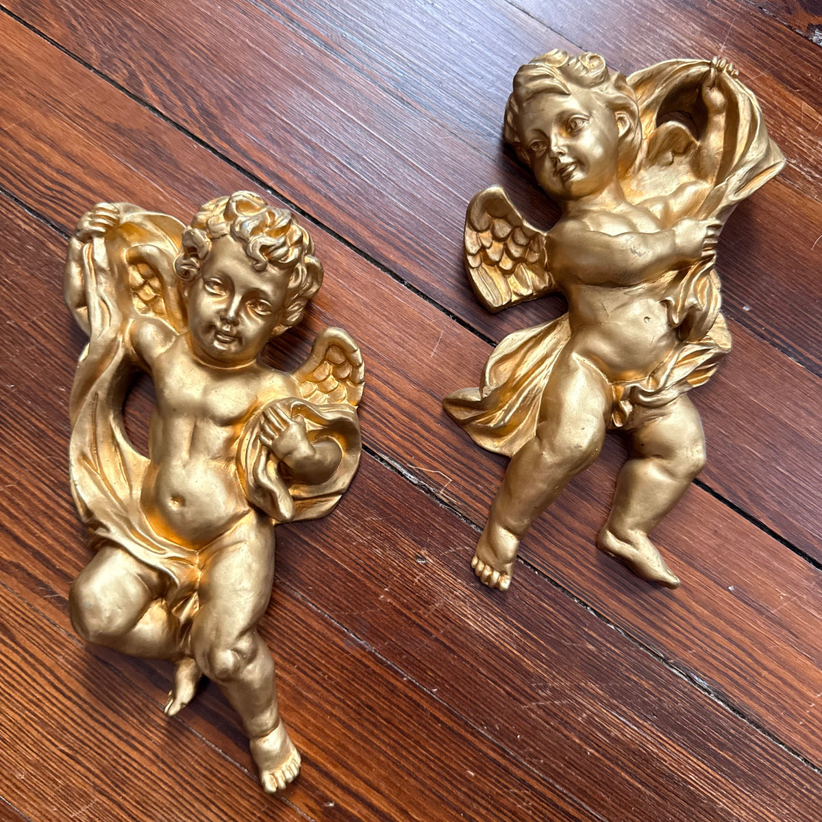 pair of gold cherubs