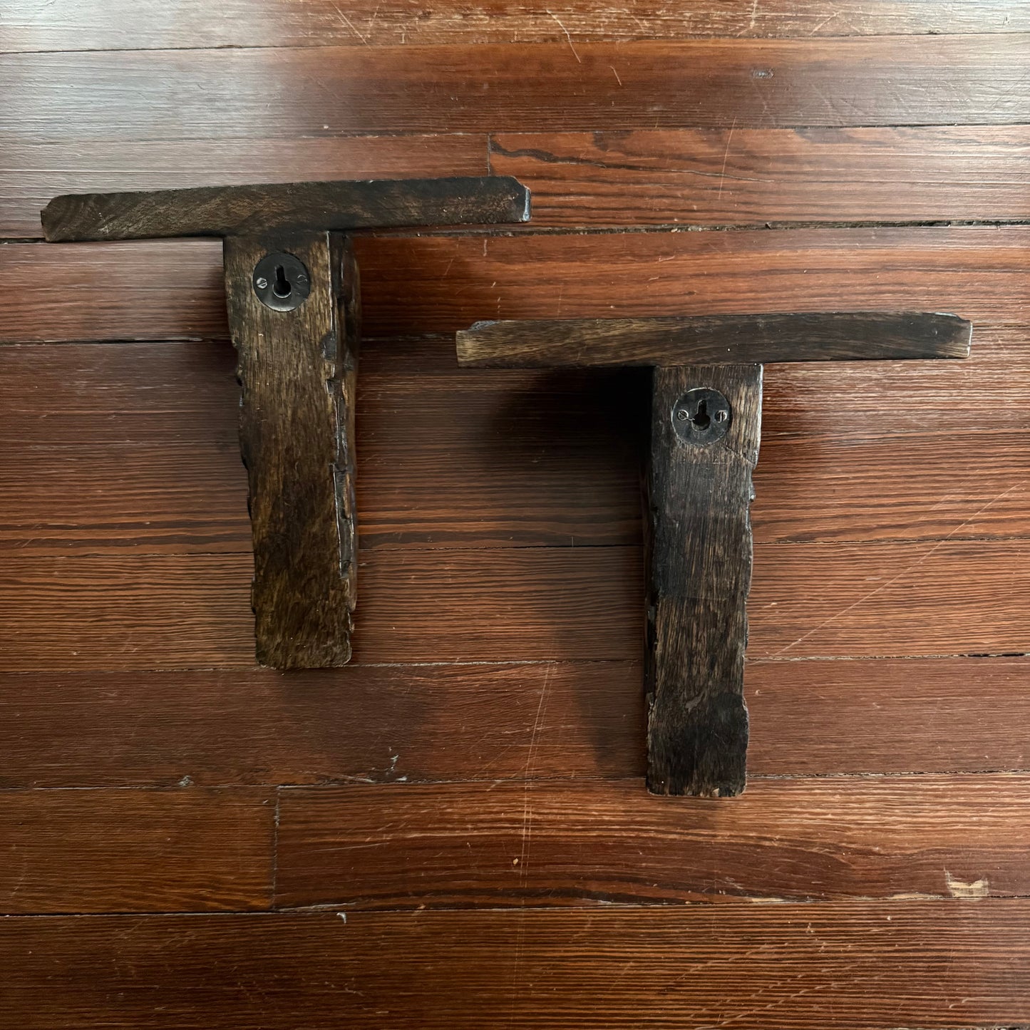 pair of carved wood wall shelves