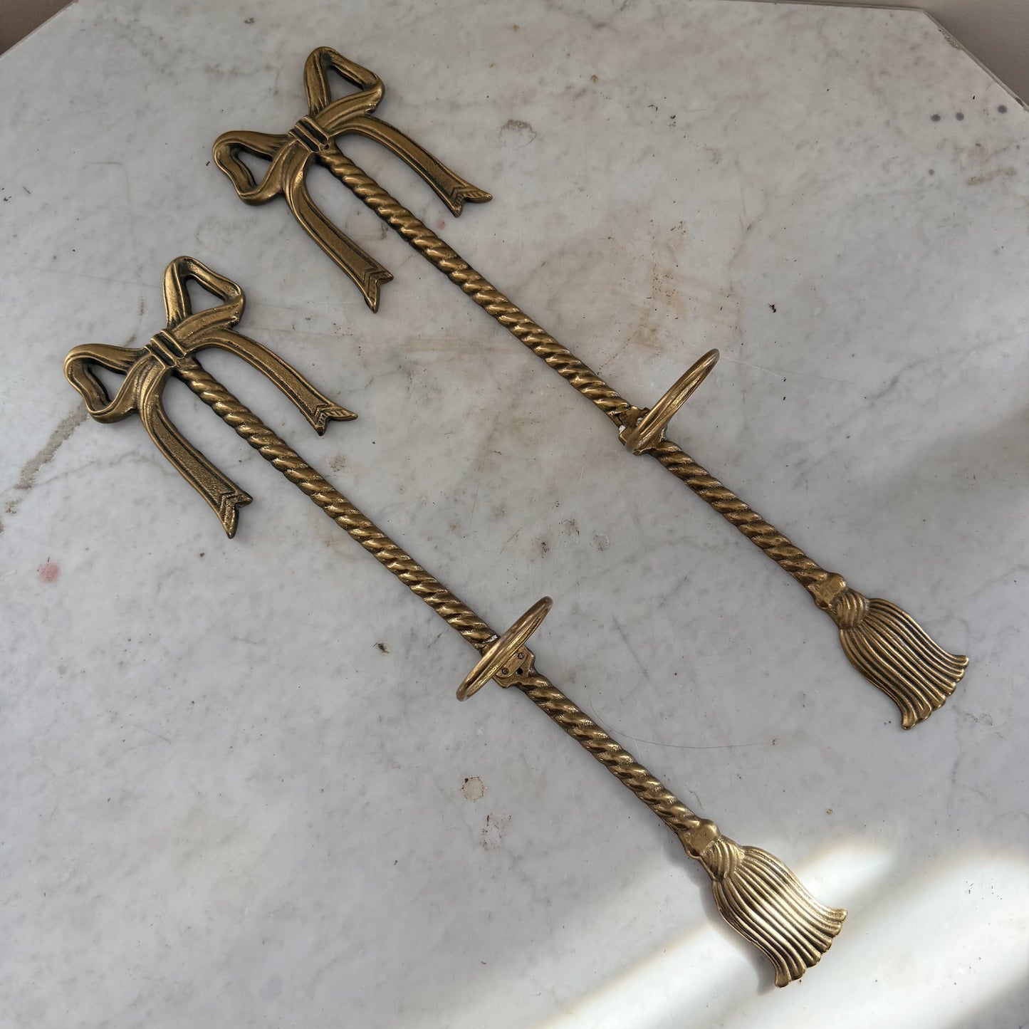 pair of brass bow vase holders