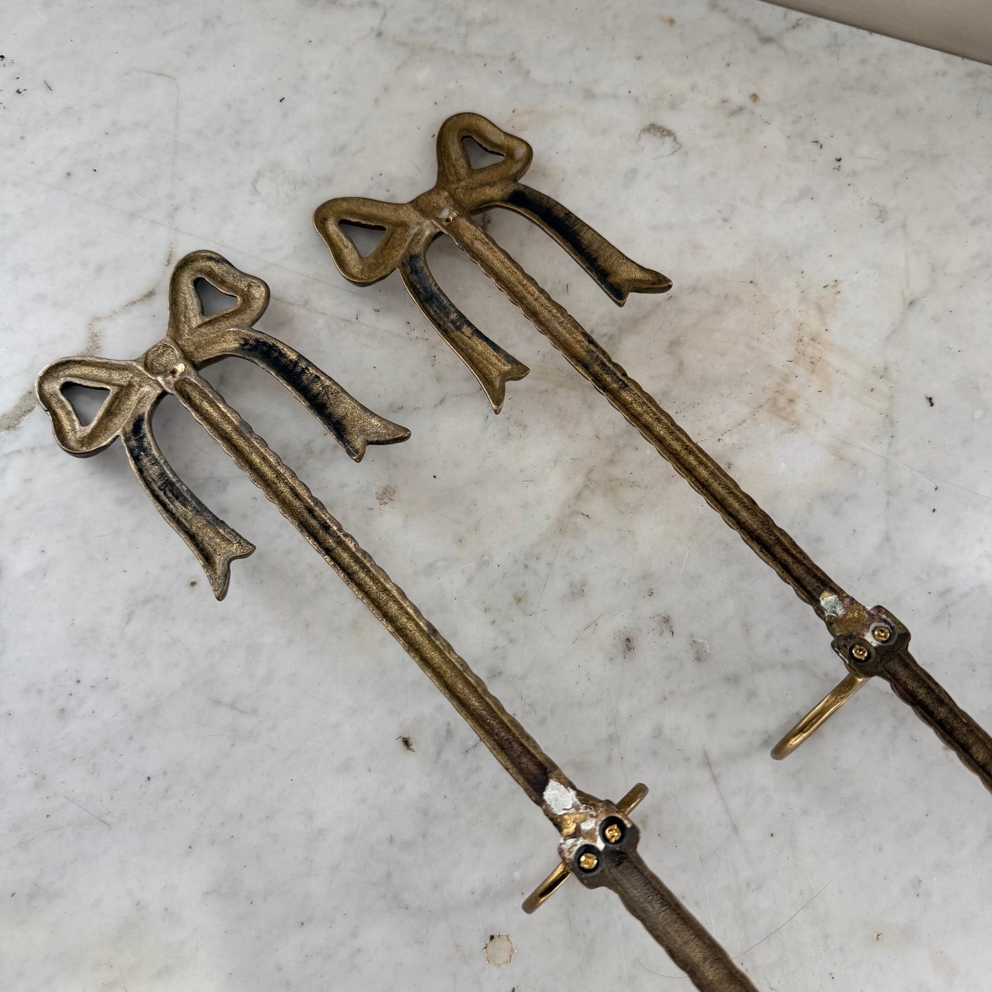 pair of brass bow vase holders