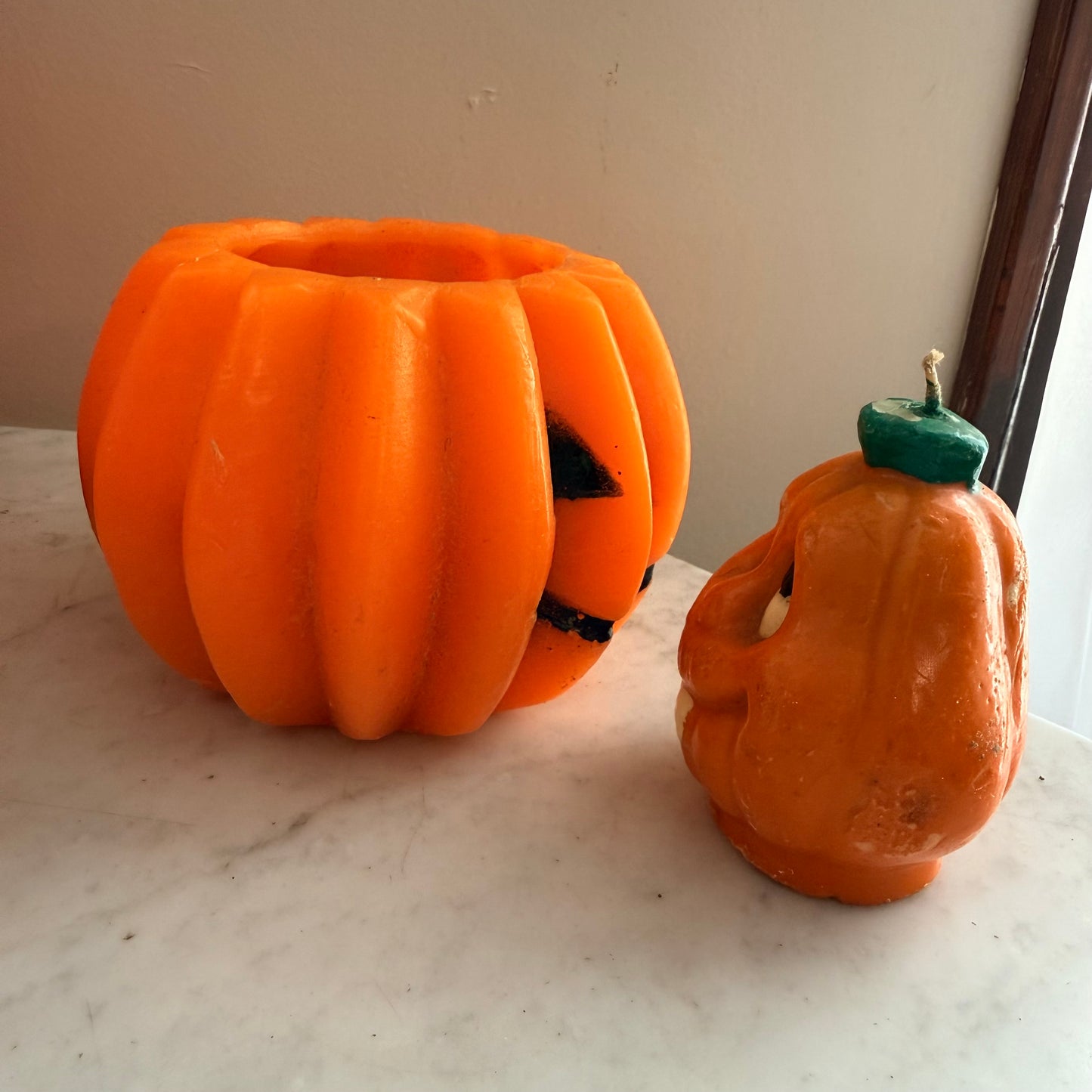 pair of vintage pumpkin candles
