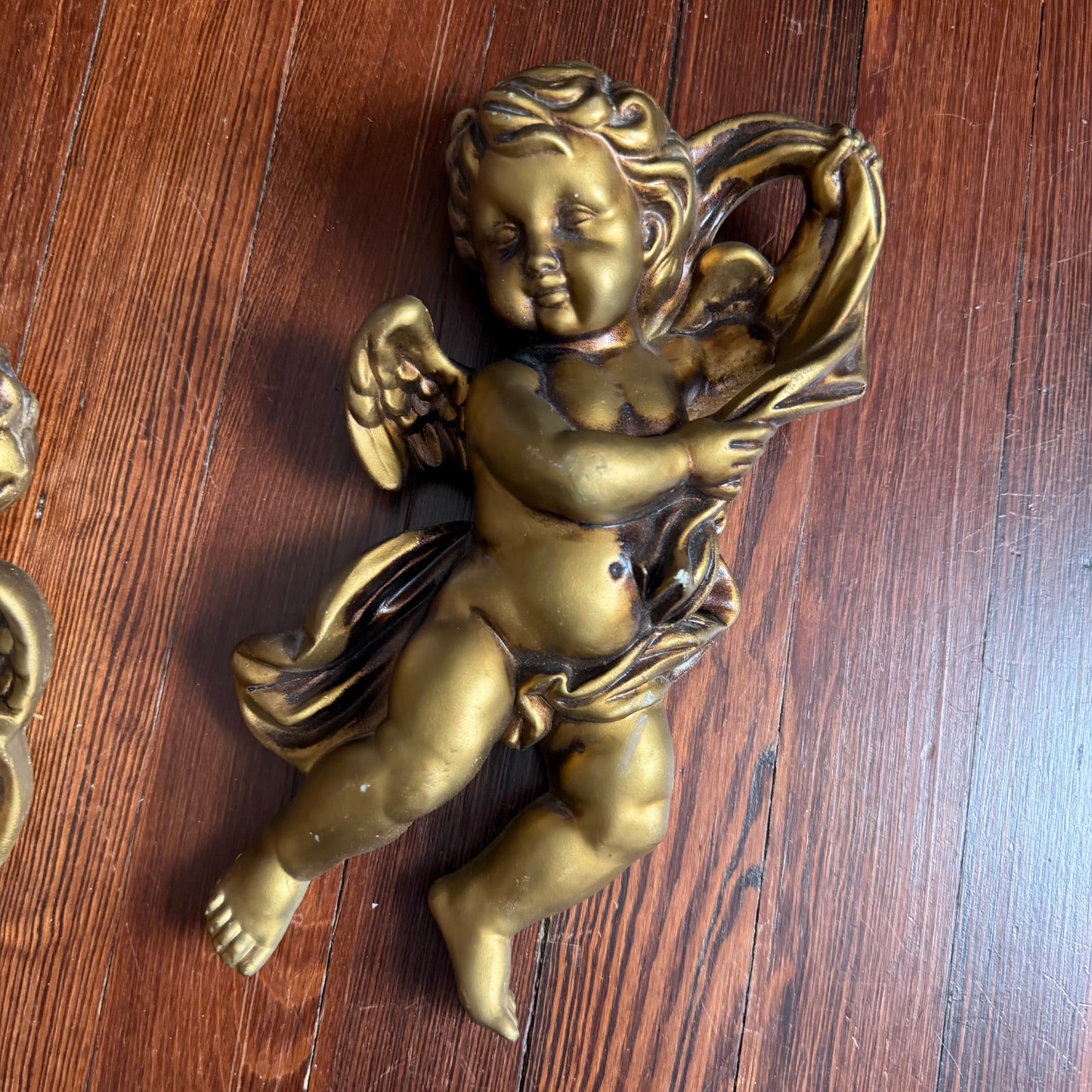 pair of wall hanging cherubs