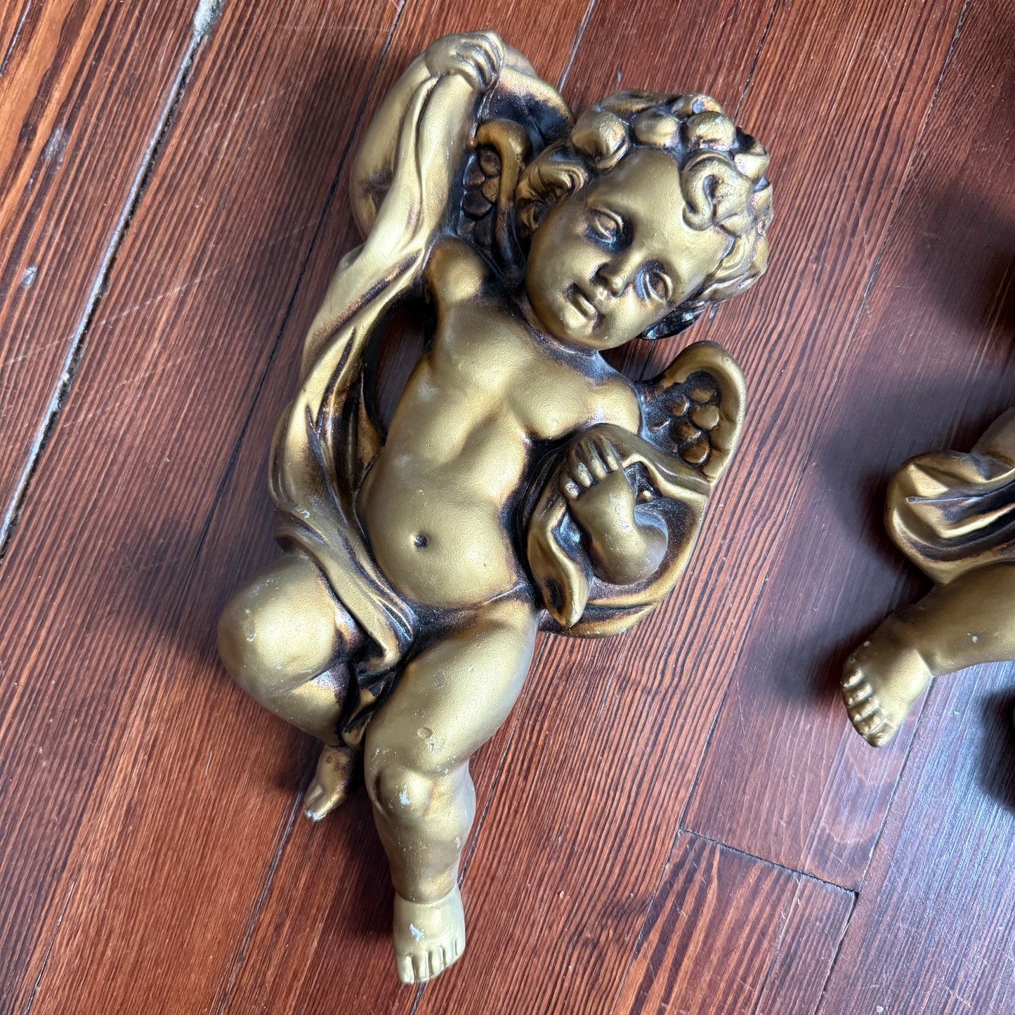 pair of wall hanging cherubs