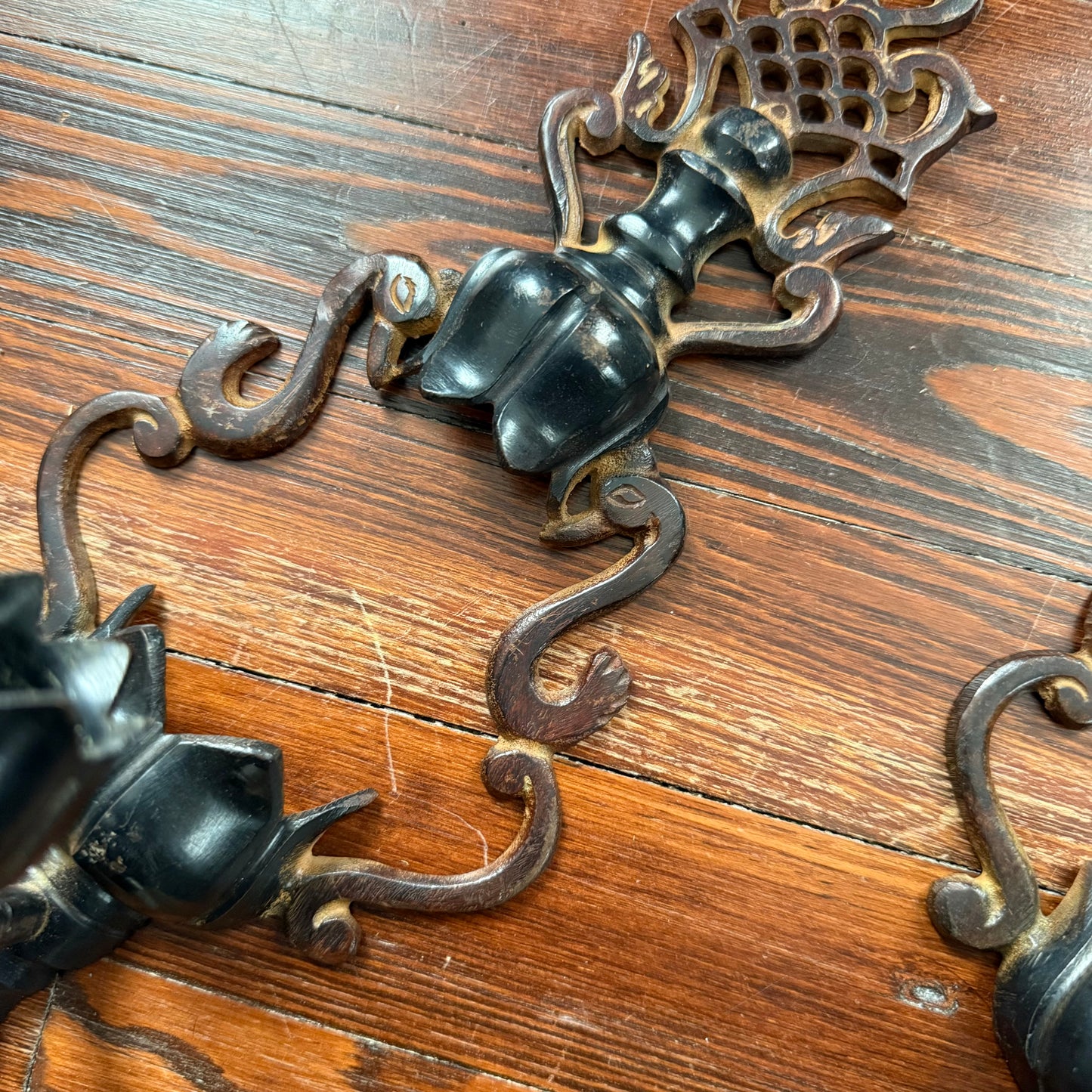pair of cast iron sconces