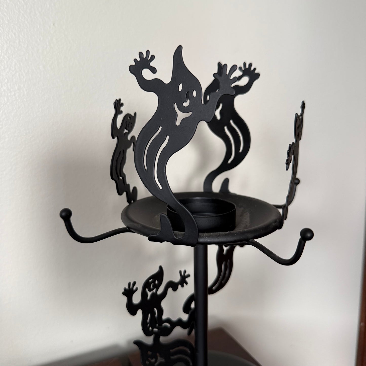 metal glowing ghost candle holder