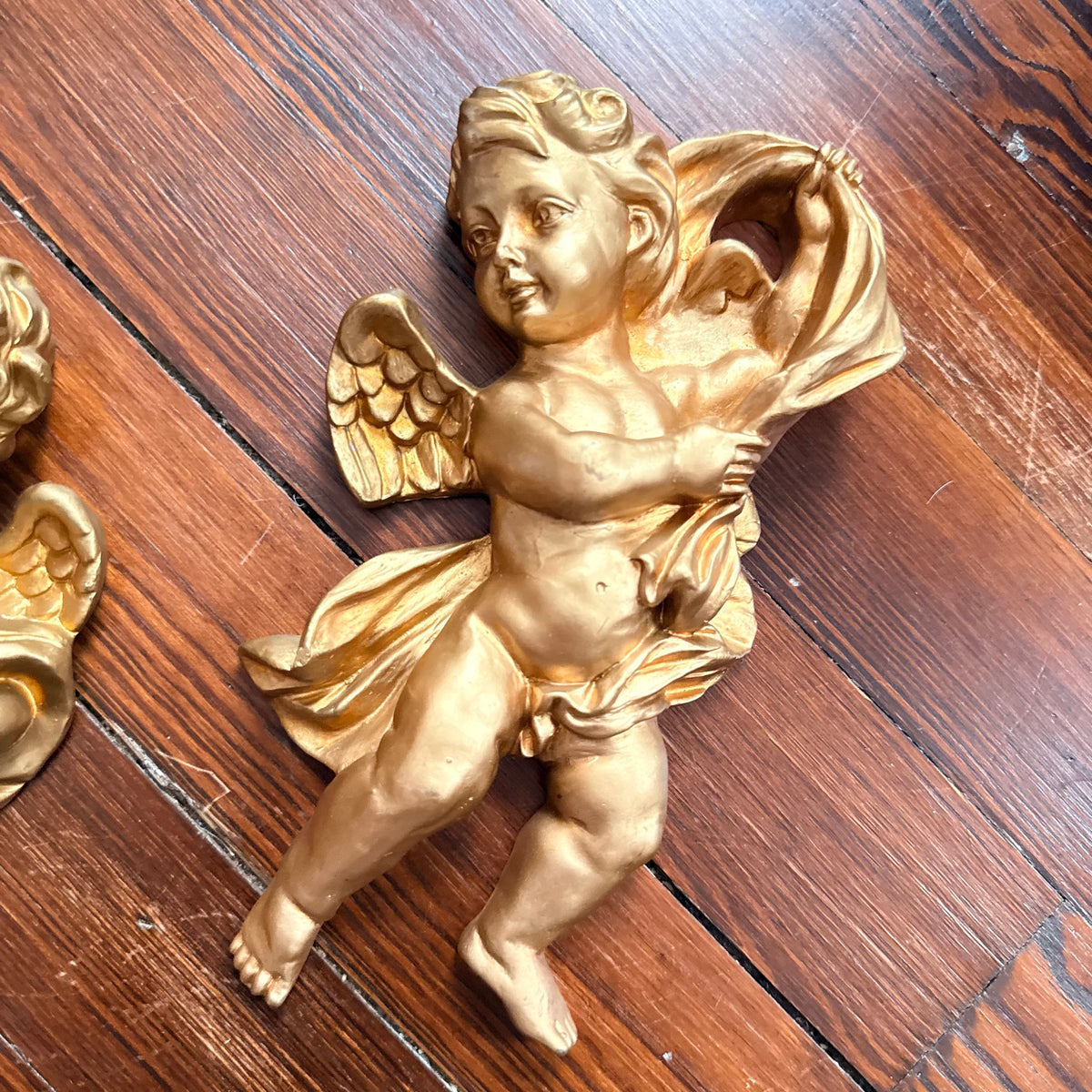 pair of gold cherubs