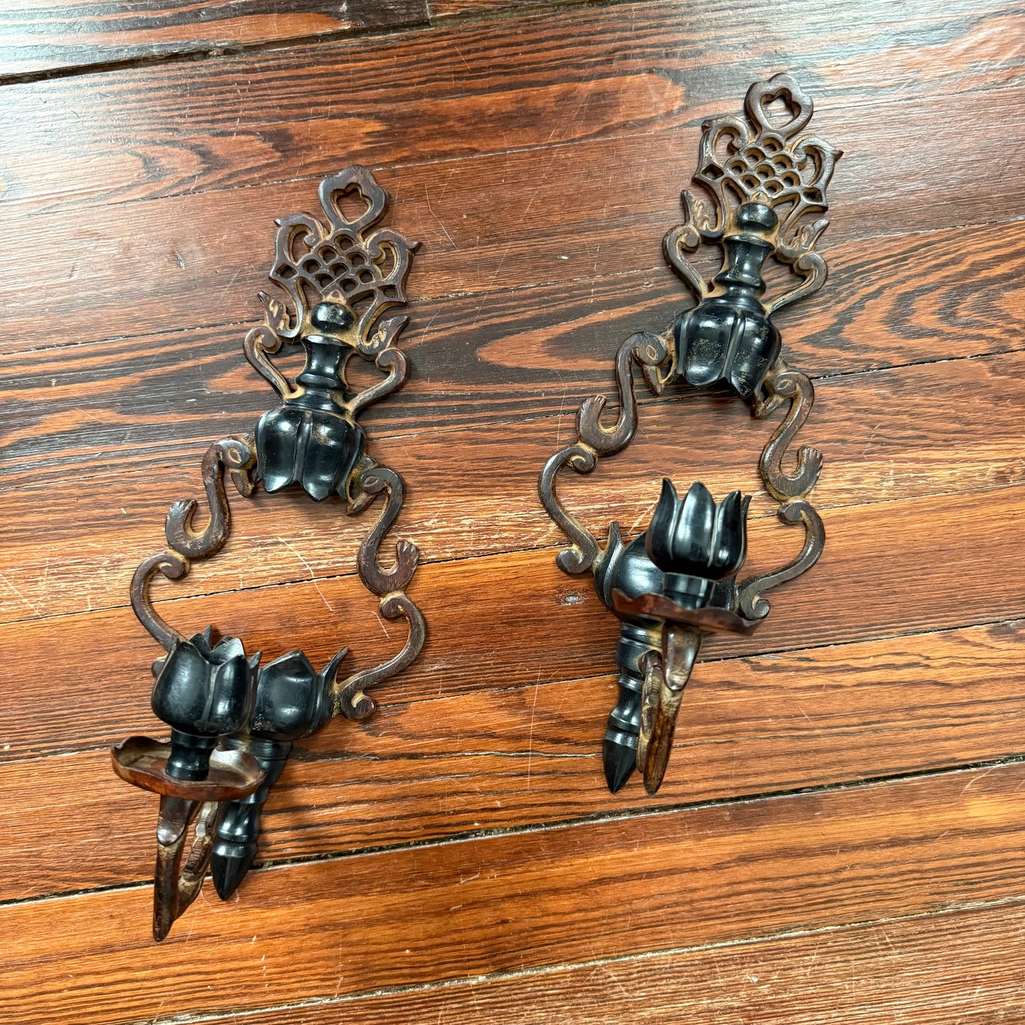 pair of cast iron sconces