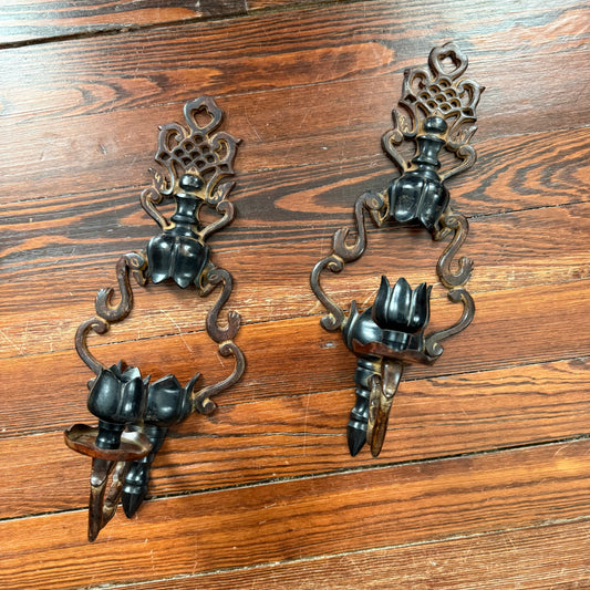 pair of cast iron sconces