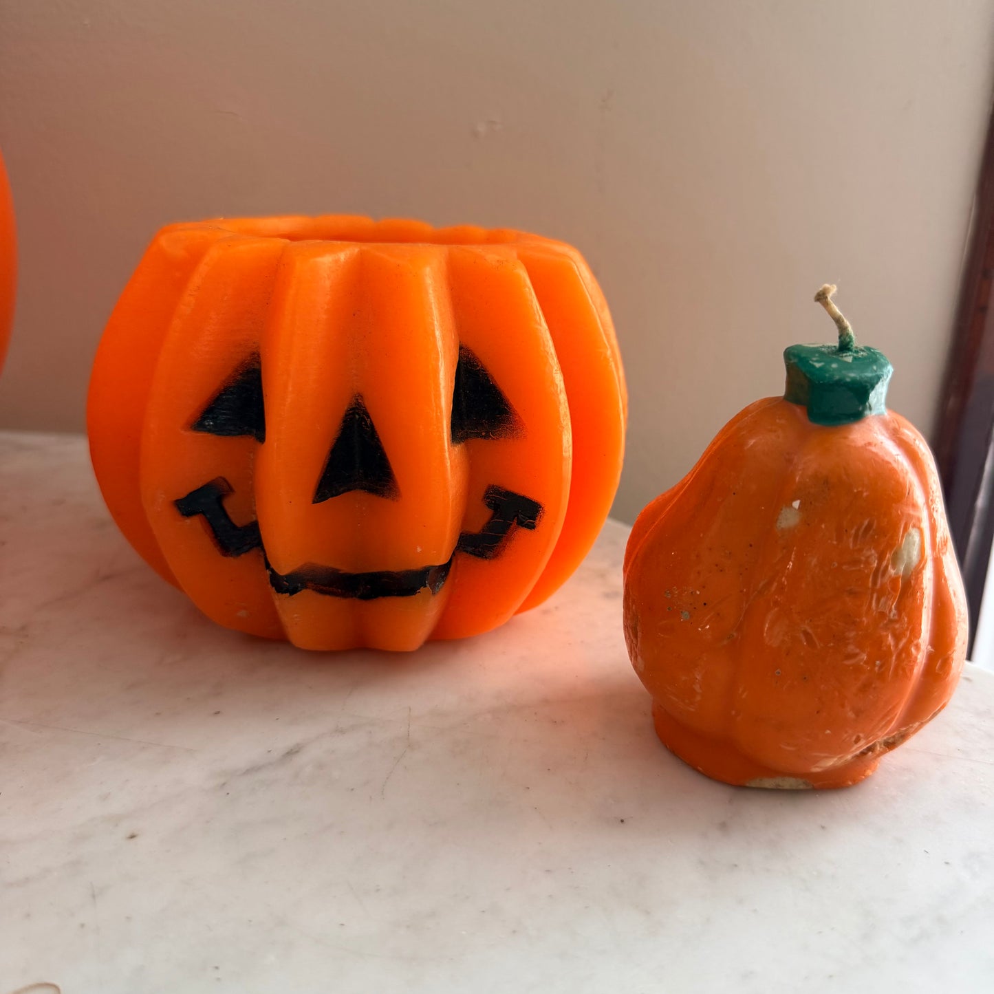 pair of vintage pumpkin candles
