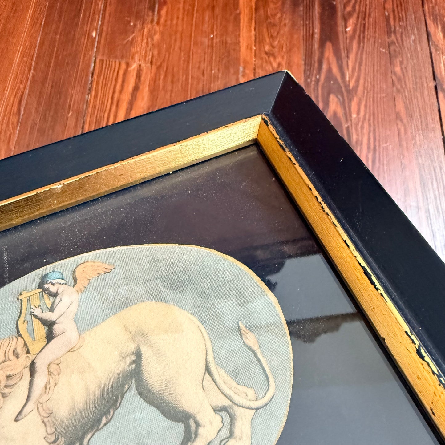 framed cupid and lion litho