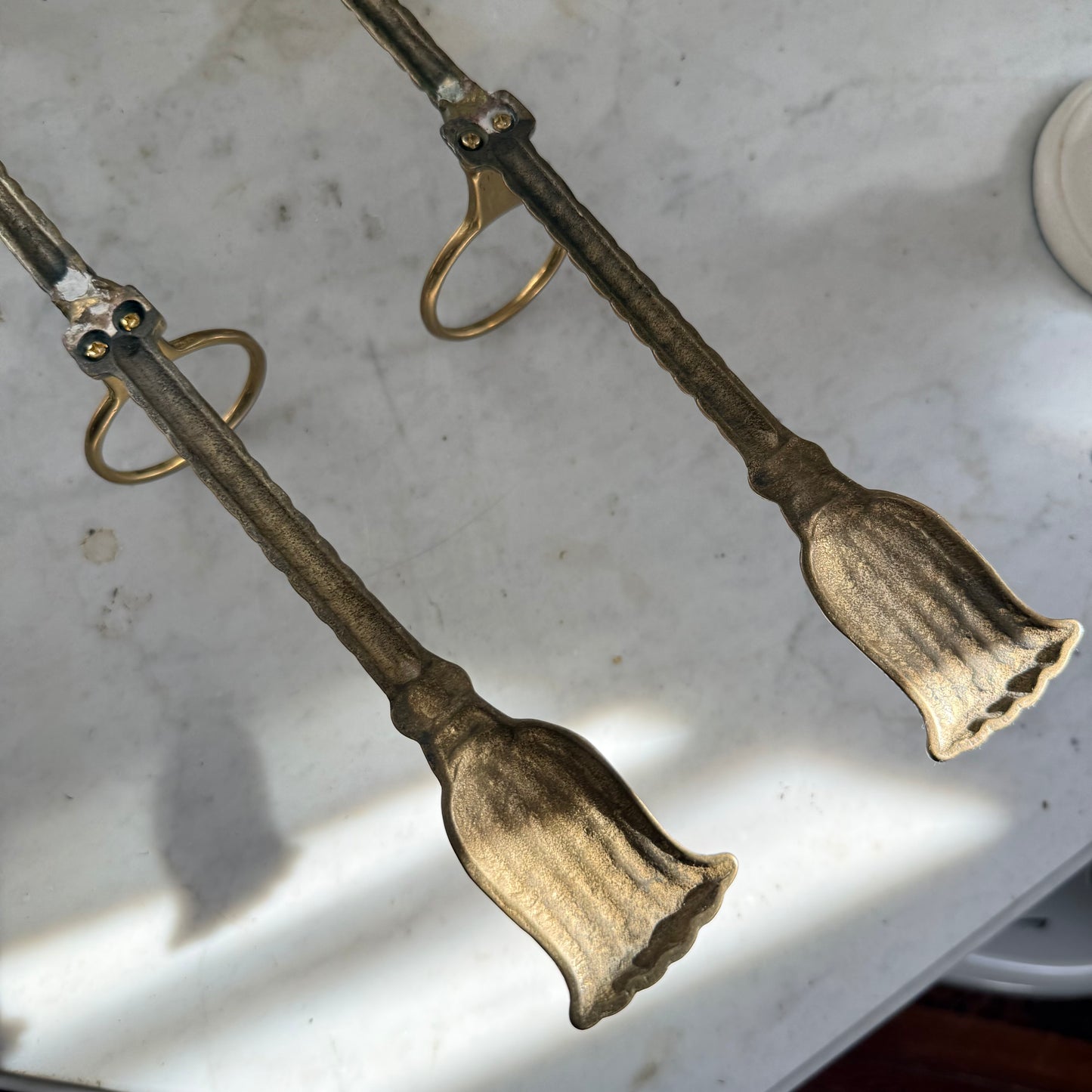 pair of brass bow vase holders