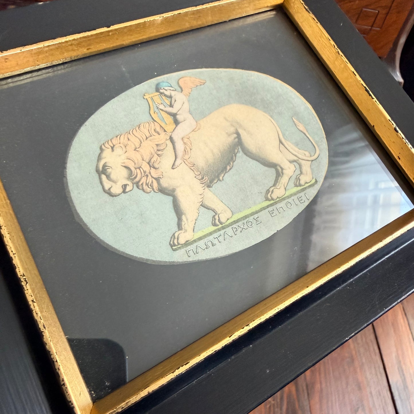 framed cupid and lion litho