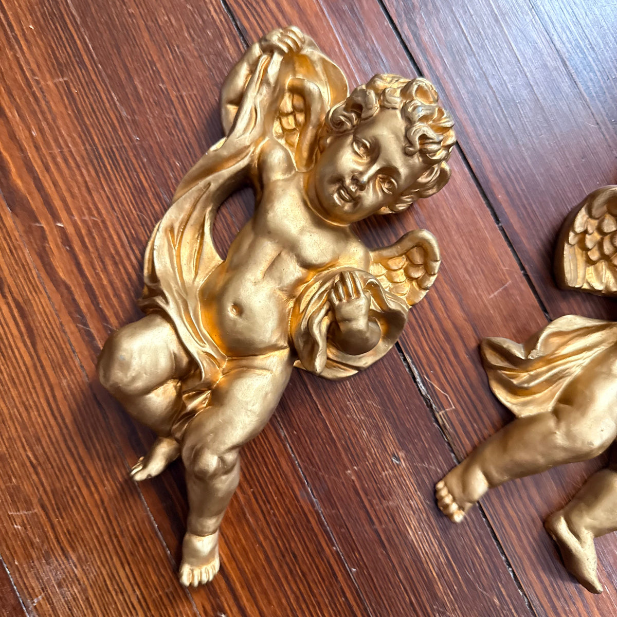 pair of gold cherubs