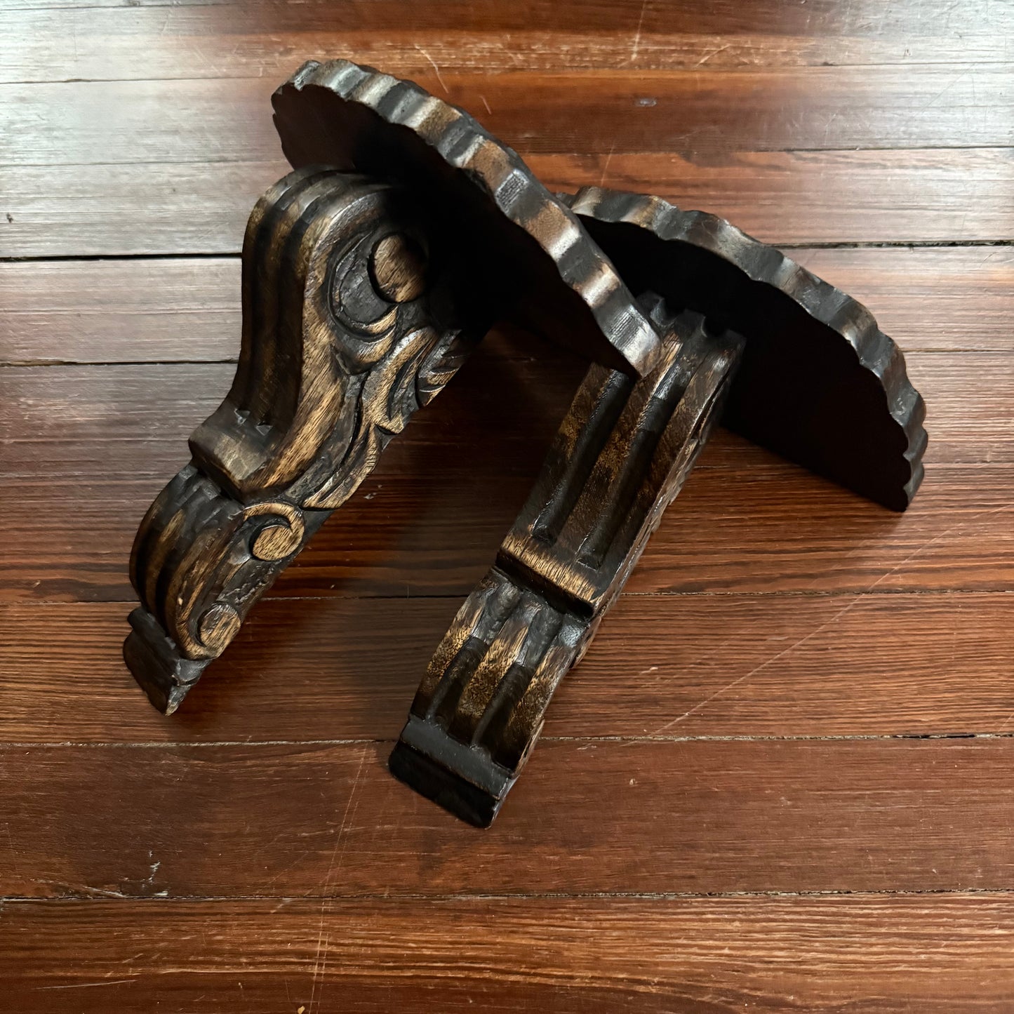 pair of carved wood wall shelves