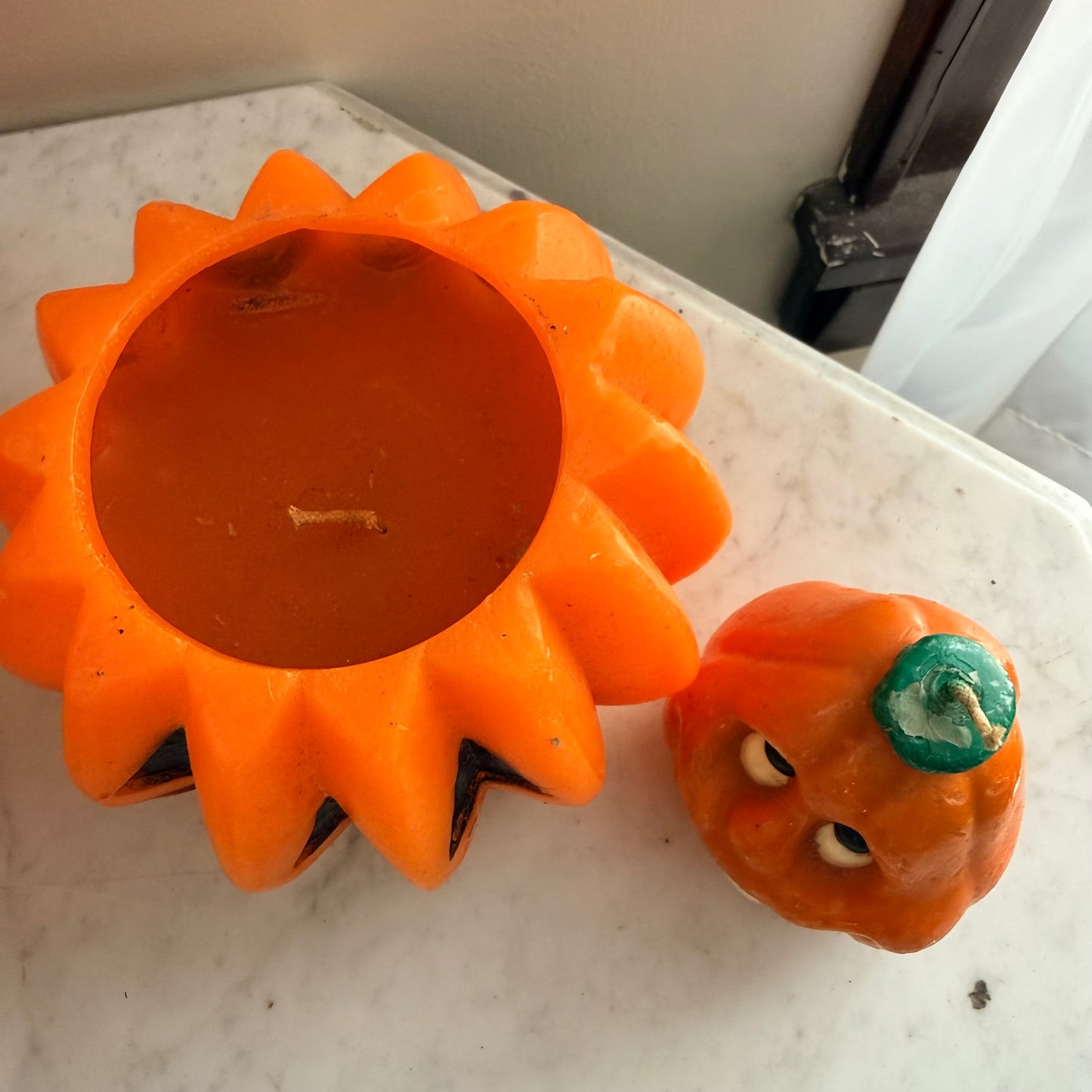 pair of vintage pumpkin candles