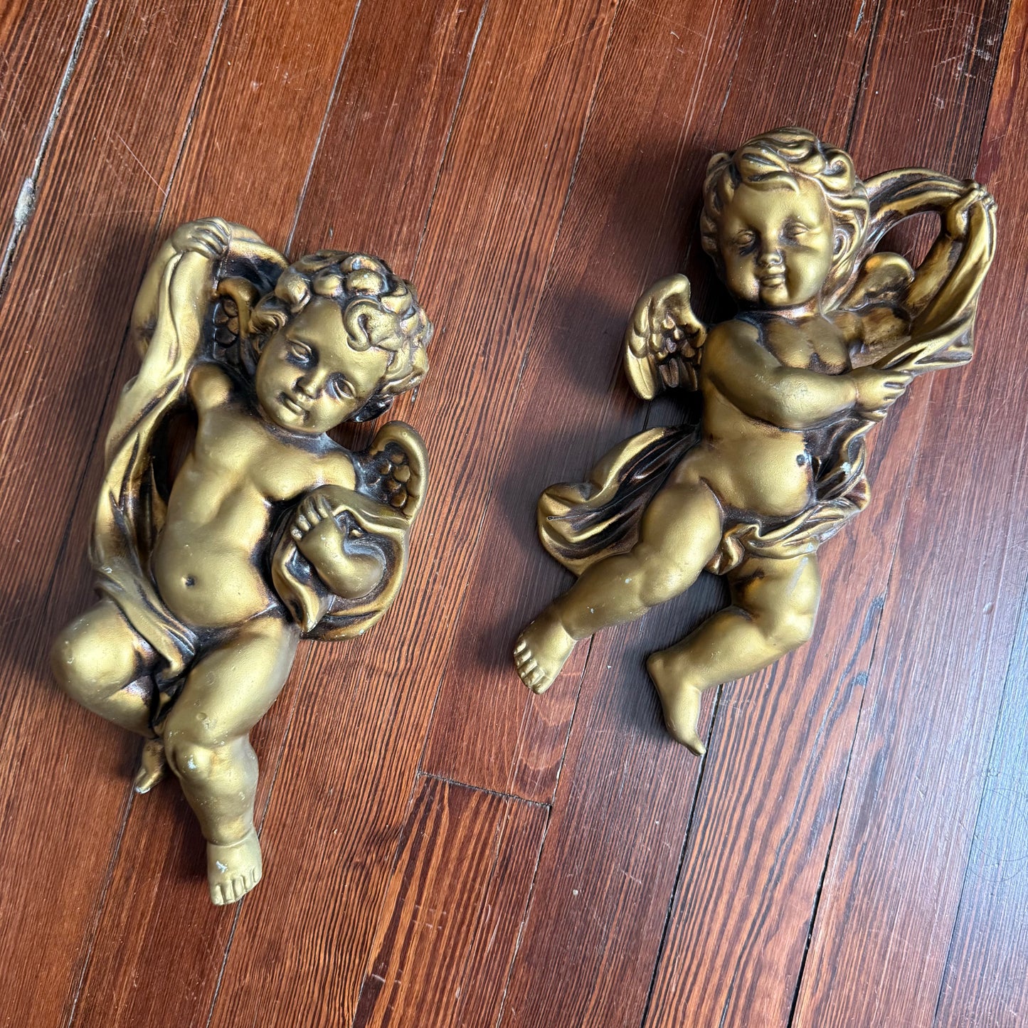 pair of wall hanging cherubs